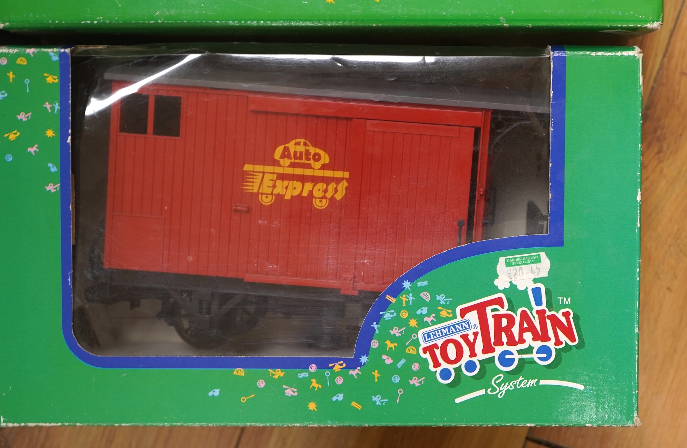 Four Lehmann and Bachmann G scale (45mm gauge) freight wagons; an unconstructed Bachmann Big Haulers G Kits 4-door Baggage Car (98910), an LGB 4-wheel coach in associated box, plus two others by Lehmann Toytrain in assoc